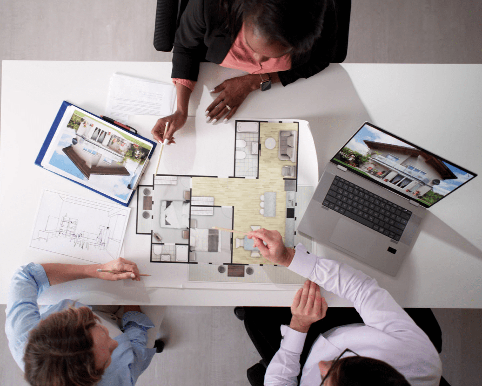 Architects discussing a floor plan design